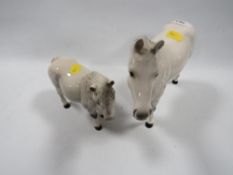 A Beswick grey mare together with a Royal Doulton grey Shetland pony (2)