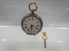 An antique pocket watch with gold and silver case