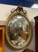 An antique gilt wall mirror with vase surmount H 80 cm