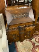 A heavy carved oak bureau W 84 cm