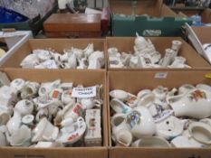 Four small trays of assorted crested ware