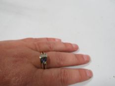 A hallmarked 18 carat gold Tanzanite ring approx. weight 4.2g