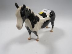 A Beswick piebald horse