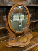 A Victorian mahogany oval dressing mirror