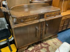 A heavy carved oak sideboard W 136 cm