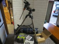A Celestron Astromaster 130 telescope and accessories