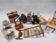 A small collection of miniature dolls and dolls house furniture