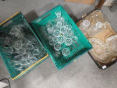 Three trays of assorted glassware to include decanters