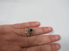 A hallmarked 9 carat gold sapphire and diamond ring together with a hallmarked 9 carat gold wishbone