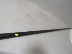 A one piece snooker cue in metal carry case