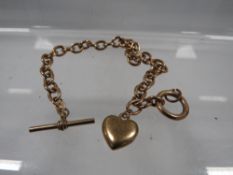 A hallmarked 9 carat gold bracelet with an unmarked yellow metal charm approx. weight 8.9g