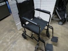A drive push along fold away wheel chair