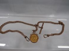 A 9ct rose gold Albert chain and t-bar with half sovereign - King George V dated 1911