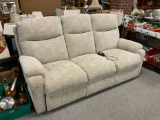 A modern upholstered four piece electric suite with three and two seater settees, armchair and stool