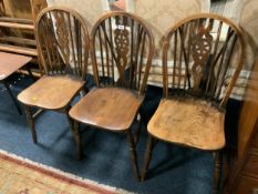 Three vintage wheelback chairs