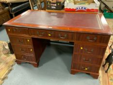 A mahogany twin pedestal desk with inset leather writing surface W 138 cm