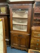 An antique oak glazed floor standing corner cabinet H 210 cm