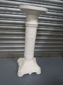 A ceramic jardinière stand