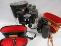 Three assorted pairs of binoculars