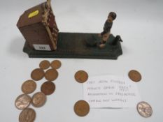 A vintage cast iron novelty money bank in the form of a footballer taking a penalty RdNo 247326