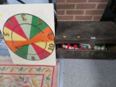 A tin trunk containing a vintage game ???