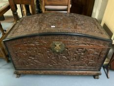 A large Eastern carved camphor wood domed chest W 105 cm