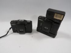A vintage Cosina CX-2 together with a CX-11 auto flash, etc together with another
