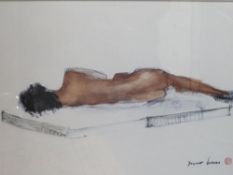 A framed glazed print of a reclining nude by Bruno Haas