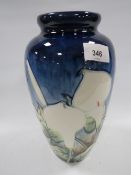 A large Old Tuptonware vase decorated with cala lilies