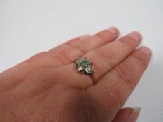A hallmarked 9 carat gold emerald and diamond dress ring approx. weight 1.3g