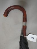 An antique 'Brigg of London' umbrella, with sterling silver collar, engraved 'De Vesci, Whites