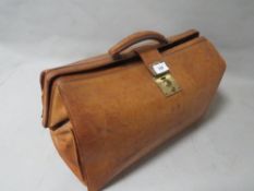 A vintage leather Gladstone style bag