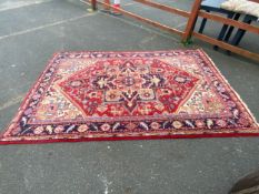 A large woollen rug 312 x 202 cm