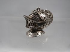 A hallmarked silver charm in the shape of a medieval helmet