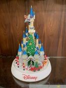 A Christmas Disney animated castle with lights and music, boxed new / old stock, working at time