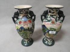 A pair of modern Oriental themed vases