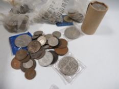 A box of coins, including a mint roll of crowns