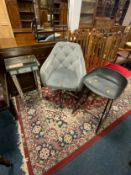 A modern upholstered office swivel armchair together with a black plastic stool and a mirrored