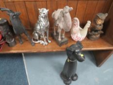 A collection of assorted animal figures to include a stag, a camel and a cheetah