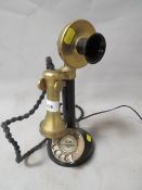 A vintage stick telephone with later conversion