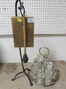 An unusual table gong together with a six bottle silver plated cruet