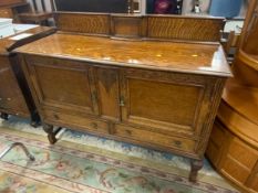 A heavy oak sideboard W 137 cm