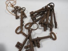 A tin of antique keys