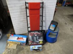 A selection of mechanics items to include boxed jacks, a crawler trolley, tyre pump, car seat covers
