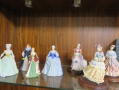 A collection of seven assorted figurines to include Franklin porcelain examples