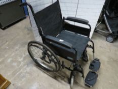 A Lomax self propelled fold away wheel chair