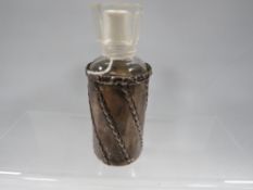 A hallmarked silver bottle sleeve