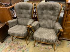 A pair of Ercol upholstered armchairs