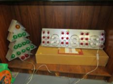 A boxed new old stock HoHoHo! illuminated Christmas sign together with a similar illuminated