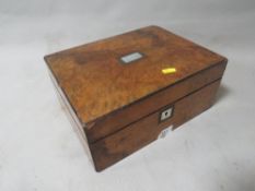 A vintage box and contents to include a silver topped trinket
